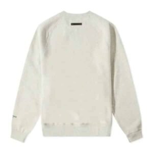 “Off-white Essentials sweatshirt for men and women with subtle branding.” Casual unisex off-white sweatshirt with Essentials logo.