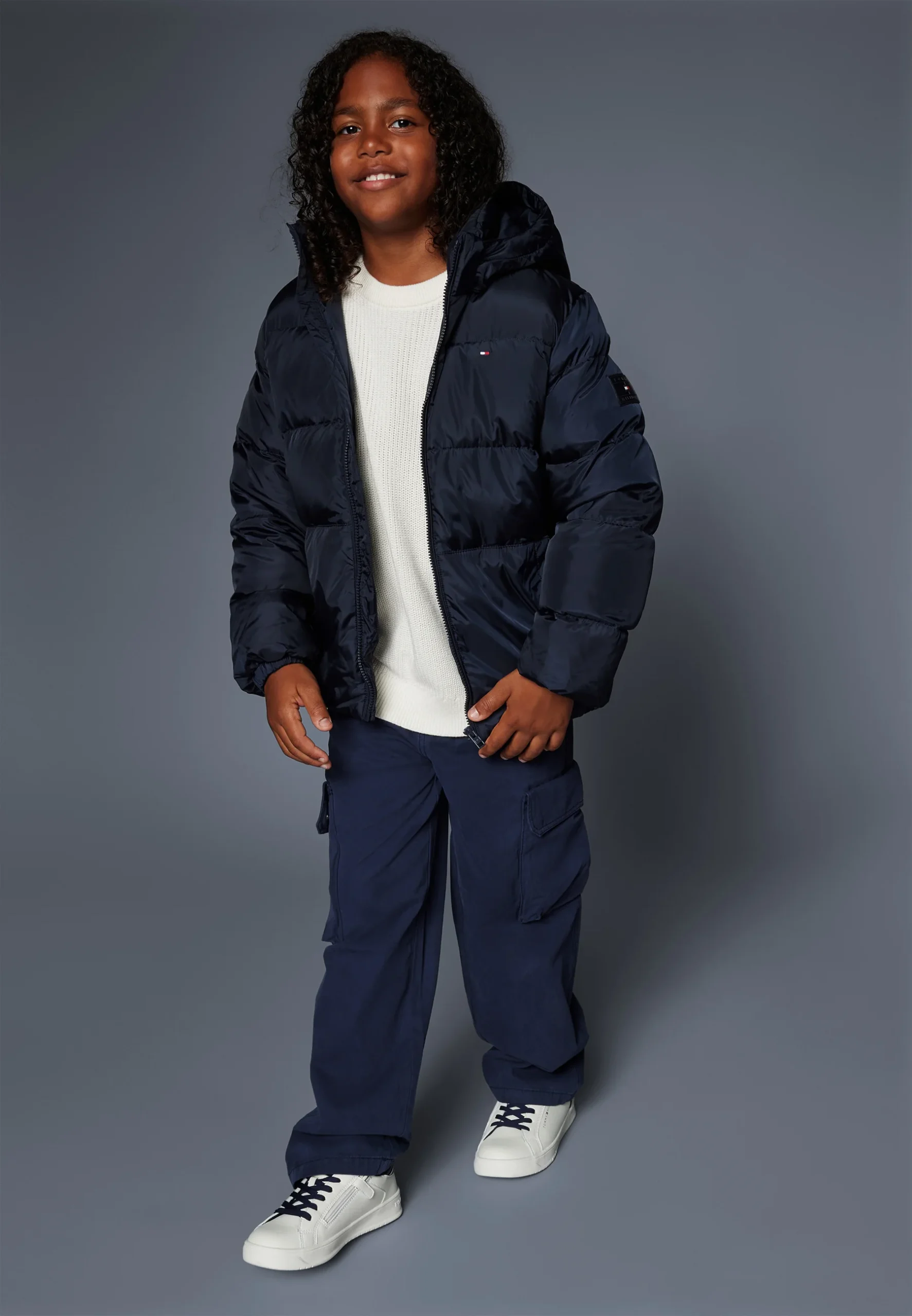 black puffer jacket front view zip closure