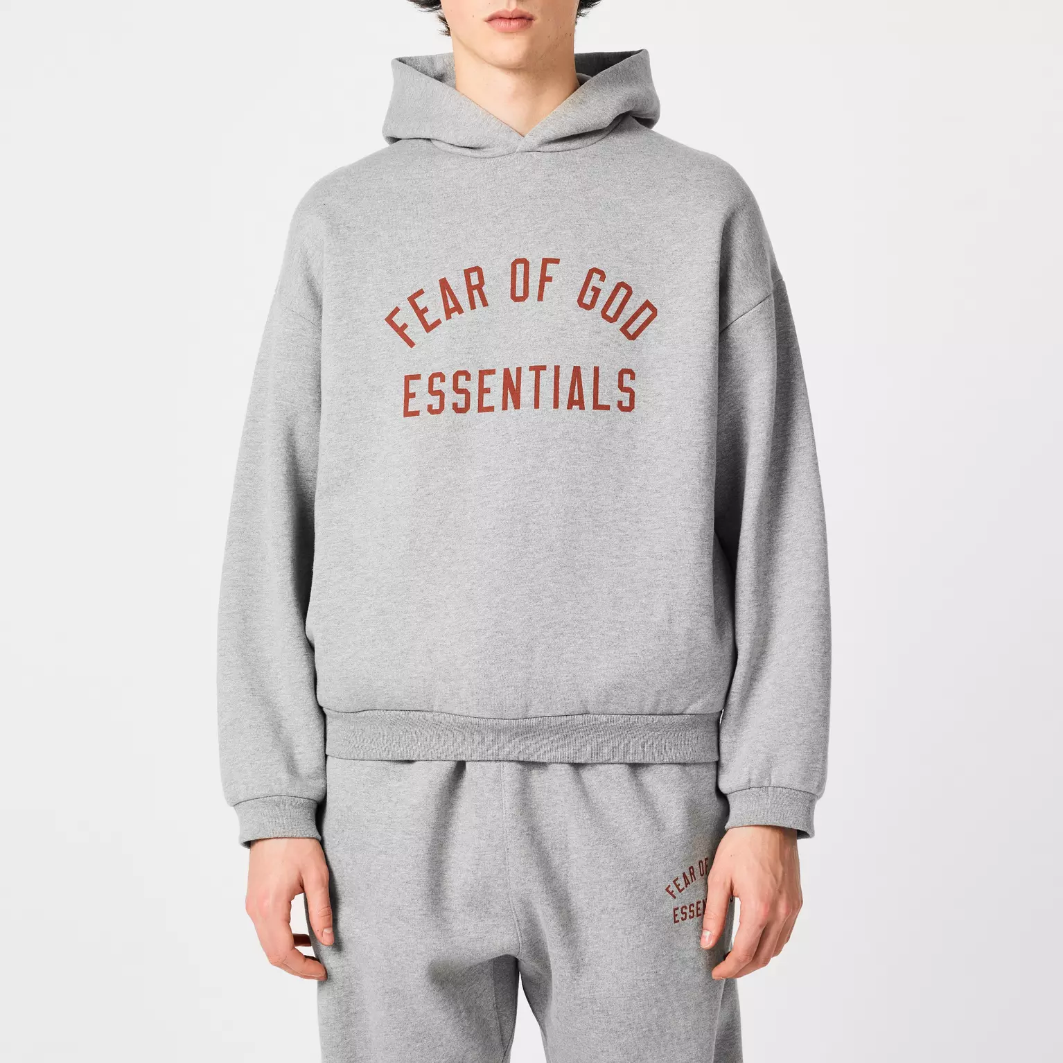 Unisex grey Fear of God Essentials hoodie, premium streetwear fashion
