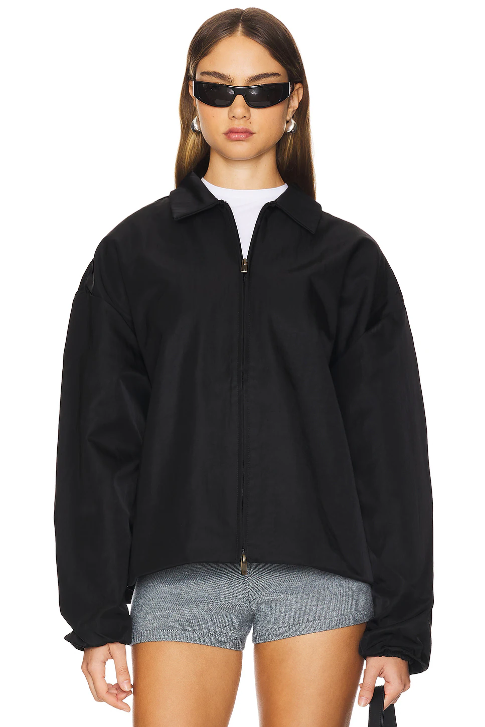 Fear of God Essentials black jacket front view with zip closure