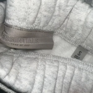 Minimalist Essentials Fear of God Men’s Grey Jogger Pants with Ribbed Cuffs and Branding