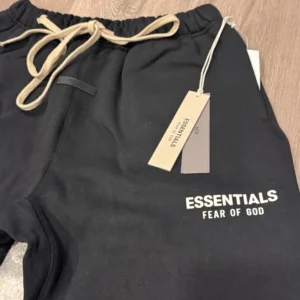 Luxury Essentials Fear of God Black Jogger Trousers for Men, Featuring Ribbed Cuffs and Minimal Branding