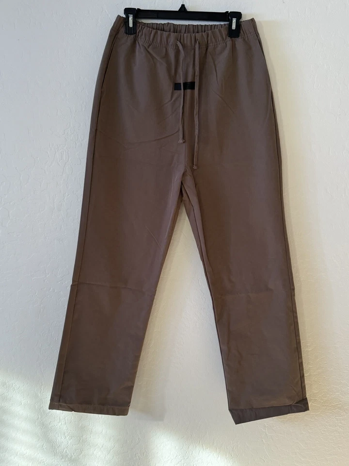 Essentials Fear of God Men's Taupe Jogger Trousers with Beige Drawstring Waistband and Minimalist Branding Tag